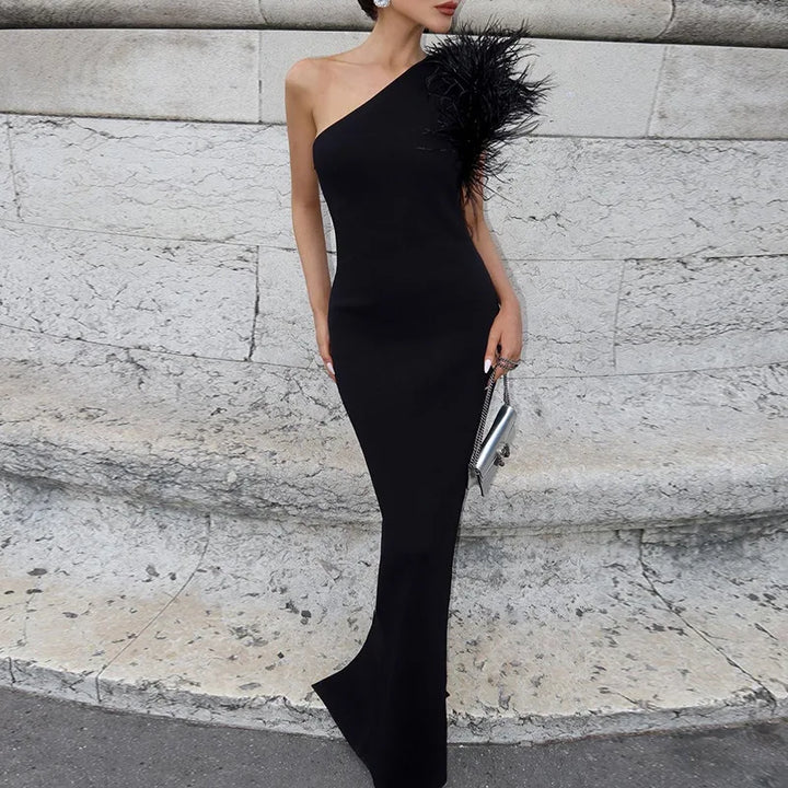 Elegant one-shoulder maxi evening dress decorated with feathers - Talia