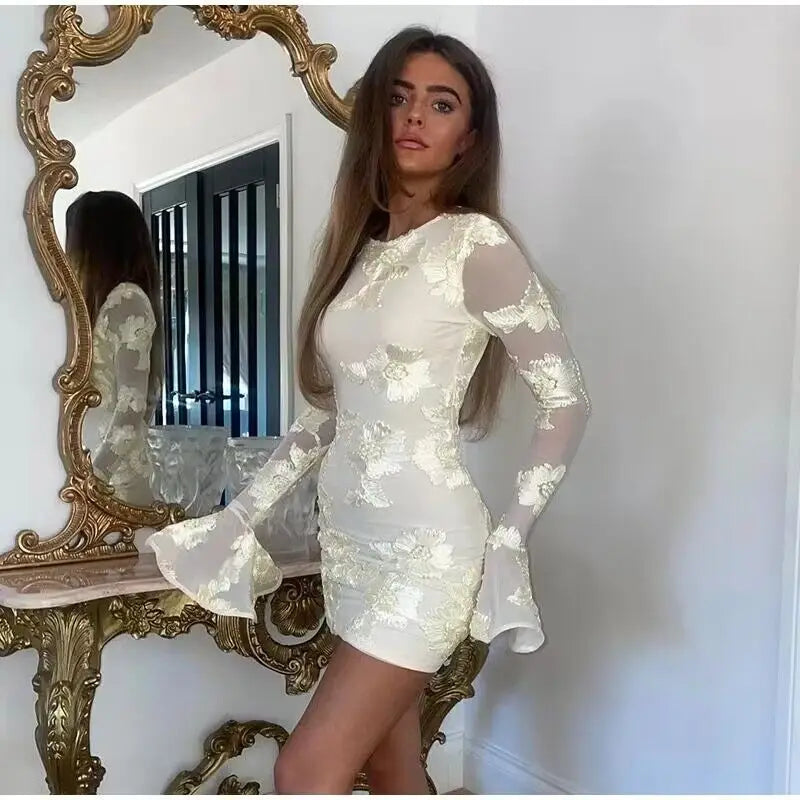 Mini dress decorated with floral embroidery and open back - Michaela