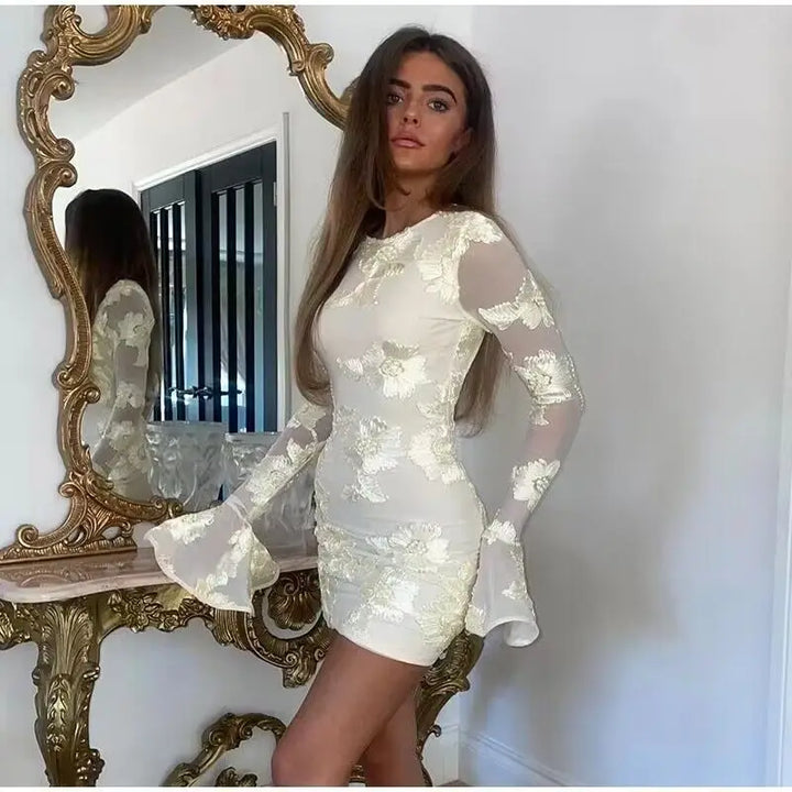 Mini dress decorated with floral embroidery and open back - Michaela