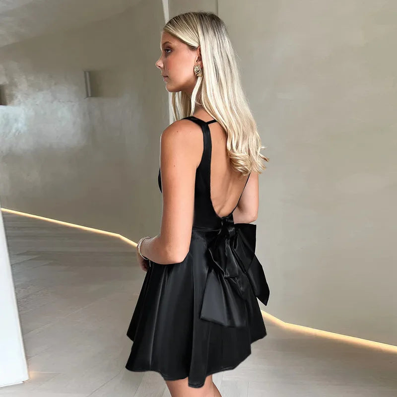 Silk satin mini dress in A-line cut with open back and bow detail - ELLIE