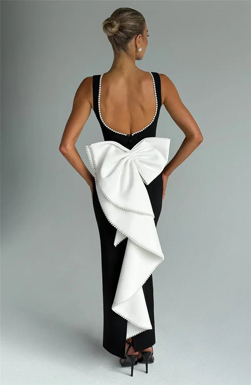 Elegant maxi dress with open back, bow, and pearl decoration - Alberta