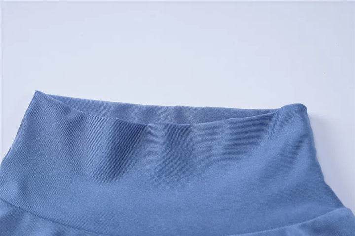 Turtleneck mini dress with bell sleeves and ruffle detail - Jenna