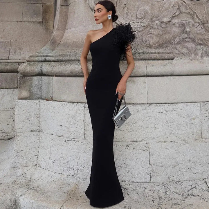 Elegant one-shoulder maxi evening dress decorated with feathers - Talia