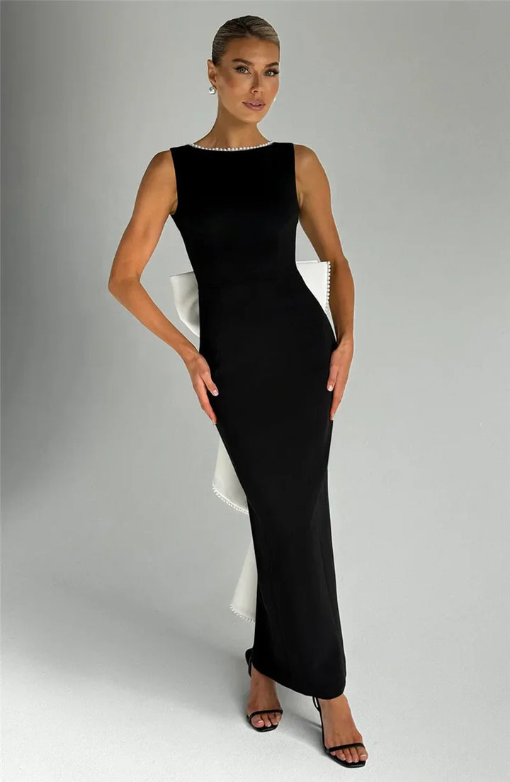 Elegant maxi dress with open back, bow, and pearl decoration - Alberta