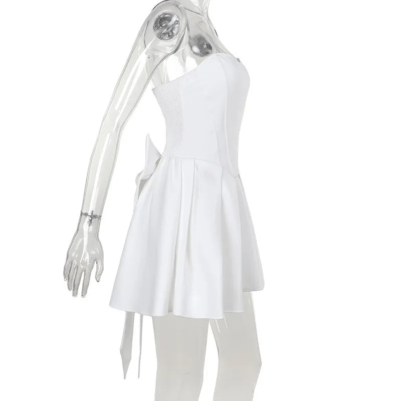 Strapless mini dress with bow detail on the back and added tulle underskirt - Novalee