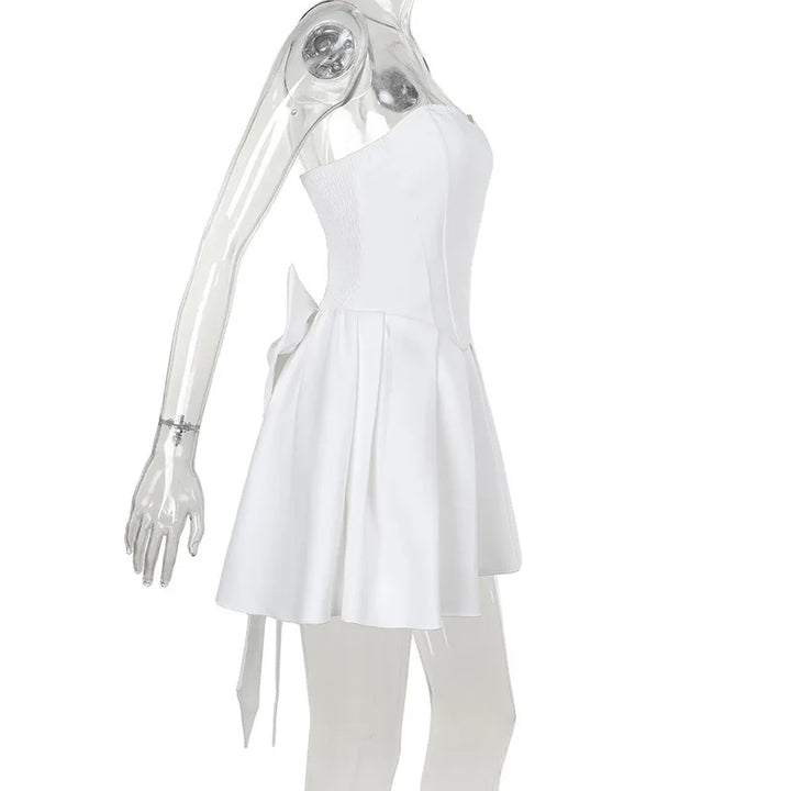 Strapless mini dress with bow detail on the back and added tulle underskirt - Novalee