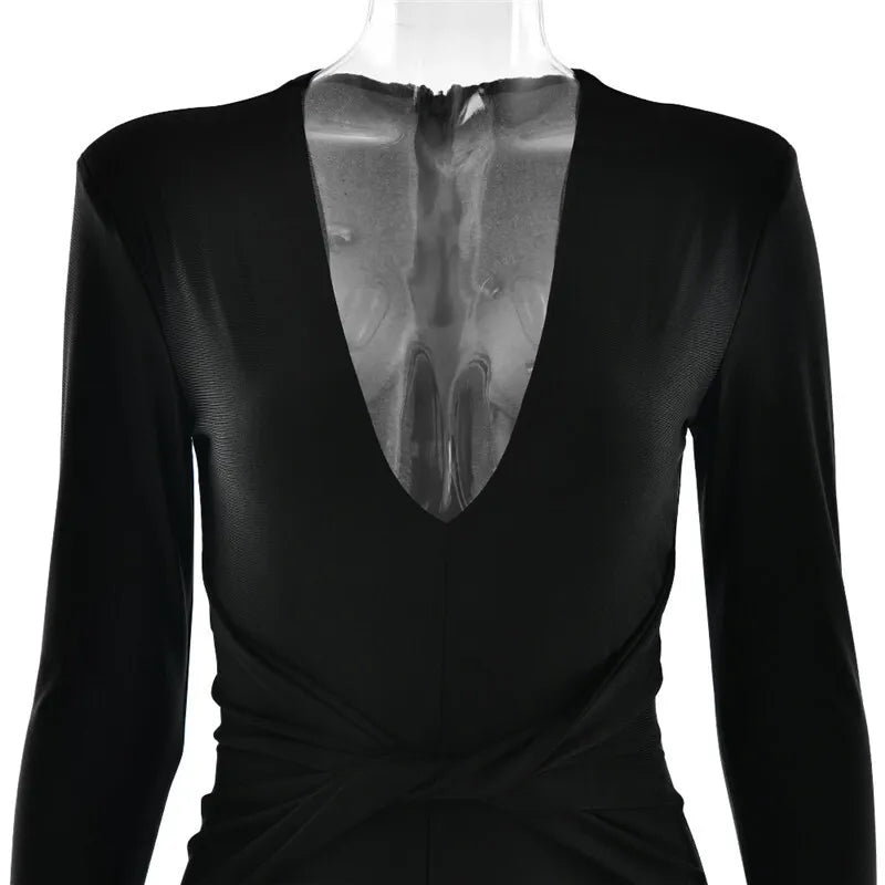 Fitted long jumpsuit with shaping fabric, deep V neckline, and cross decoration - Laini