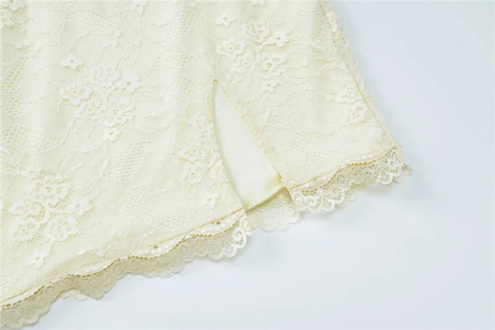 Fitted mini dress with lace, floral embroidery, and small slit - Neil
