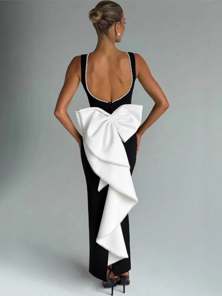 Elegant maxi dress with open back, bow, and pearl decoration - Alberta