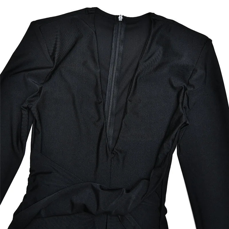 Fitted long jumpsuit with shaping fabric, deep V neckline, and cross decoration - Laini