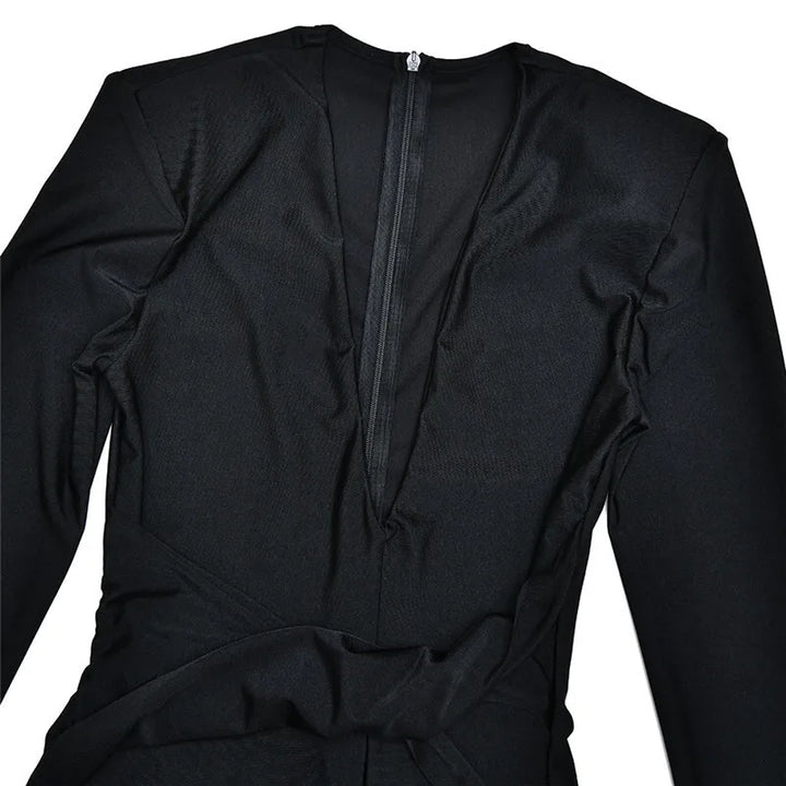 Fitted long jumpsuit with shaping fabric, deep V neckline, and cross decoration - Laini