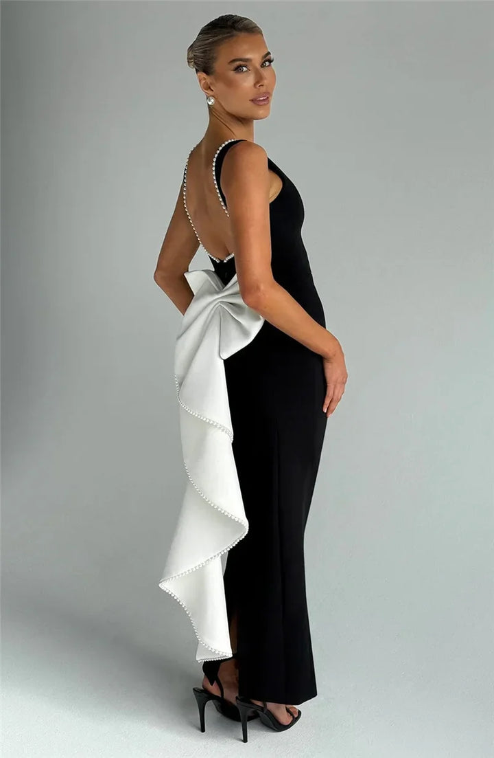 Elegant maxi dress with open back, bow, and pearl decoration - Alberta