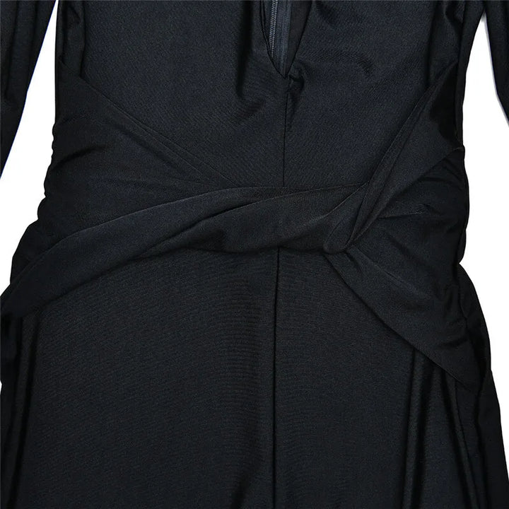 Fitted long jumpsuit with shaping fabric, deep V neckline, and cross decoration - Laini