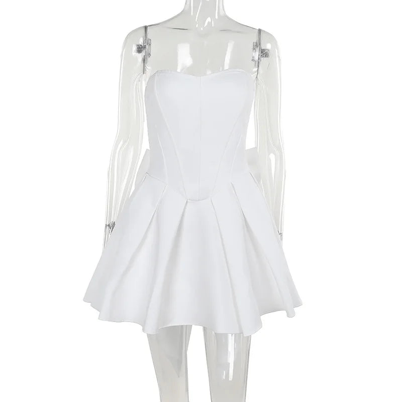 Strapless mini dress with bow detail on the back and added tulle underskirt - Novalee